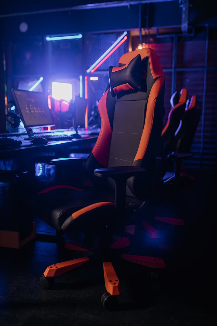 A sleek gaming chair in a neon-lit environment, perfect for gaming enthusiasts.